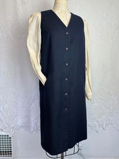 A lovely vintage longline navy blue wool waistcoat. Wear it as a vest dress, or open as a sleeveless duster. A classic piece for any "academia" aesthetic wardrobe. Timeless and seasonless. Vintage brand "Andrea Viccaro." 100% Wool. Tag size L. 38" Long 19" Pit to pit 39" Waist 40" Hips Bundle Discount Get 10% off when you purchase two or more items from Terra Exchange with code TERRABUNDLE FREE SHIPPING! On any order totaling $35 or more (only valid within the U.S.) Dark Academia Waistcoat, Aesthetic Wardrobe, Sleeveless Duster, Wool Waistcoat, Waistcoat Dress, Gilet Long, Vintage Branding, Blue Wool, Vest Dress