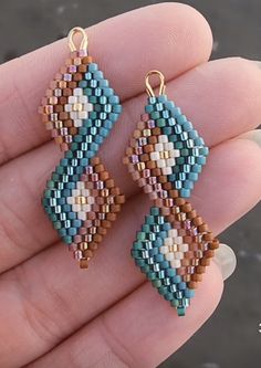 the beaded earrings are made with different colors and shapes, including blue, brown, beige