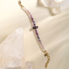 This stunning bracelet features a single amethyst accentuated by micro faceted purple ombre Fluorite stones. Crafted with an adjustable extender, this bracelet can fit up to a size 7.5" wrist for comfort and style. The perfect accessory for day or night! Adjustable Faceted Crystal Bohemian Bracelet, Adjustable Faceted Bohemian Crystal Bracelet, Bohemian Adjustable Faceted Crystal Bracelet, Adjustable Purple Beaded Bracelets For Healing, Adjustable Amethyst Bracelets With Natural Stones, Adjustable Purple Amethyst Bracelets, Adjustable Amethyst Bracelet In Purple, Adjustable Amethyst Beaded Bracelets With Natural Stones, Amethyst Beaded Bracelet For Healing