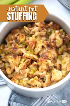 a white bowl filled with stuffing next to celery