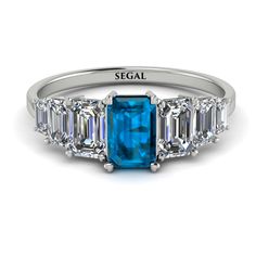 Bring something fresh and new into your style with this Emerald Cut Blue Topaz Geometric Ring. This ring is a charming band with a center emerald cut Blue Topaz and three more emeralds cut stones in each side of it. With this Emerald Cut Blue Topaz Geometric Ring, you get a ring with both luxury and style. Stock Number: 9086Blue Topaz Metal Setting Metal Type: 14K White Gold Main Stone Type: 100% Natural Blue Topaz Size: 0.56Ct / 6 x 4mm Shape: Emerald Cut Color: Blue Clarity: VS Additional Ston Geometric Ring, Conflict Free Diamonds, Cut And Color, Emerald Cut, Blue Topaz, Types Of Metal, Topaz, Platinum, Emerald