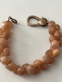 Peach moonstone teardrop beads set in a double row...clasp is a rose gold plated lobster clasp with tiny champagne diamonds. NWOT Elegant Double Strand Bracelets With Gemstone Beads, Elegant Double Strand Natural Stones Bracelets, Elegant Double Strand Gemstone Beads Bracelets, Elegant Round Moonstone Beaded Bracelet, Elegant Moonstone Gemstone Beaded Bracelets, Elegant Hand-strung Moonstone Jewelry, Elegant Moonstone Beaded Bracelets, Elegant Round Moonstone Beaded Bracelets, Rose Gold Plated Necklace With Lobster Clasp