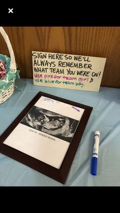 there is a sign on the table next to a basket with an egg in it