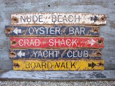 an old wooden sign that has some writing on it