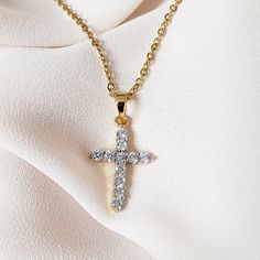 Our Medium Crystal Cross Necklace is the perfect statement piece to add just the right amount of sparkle to your outfit. MATERIAL: 24K gold plating; stainless steel; cubic zirconia crystals ✔ Non Tarnish ✔ Hypoallergenic ✔ Handmade ✔ Quality Guaranteed COLOR: gold Gold Cubic Zirconia Diamond Necklace Tarnish Resistant, Gold Crystal Jewelry As Gift For Her, Dazzling Rhinestone Clavicle Necklace For Gift, Dazzling Rhinestone Clavicle Necklace As Gift, Gold Crystal Charm Necklace With Clavicle Chain, Crystal Cross Necklace With Adjustable Chain, Dazzling Crystal Rhinestone Necklaces For Gifts, Gold Rhinestone Necklaces, Gold Dainty Crystal Necklace With Cubic Zirconia