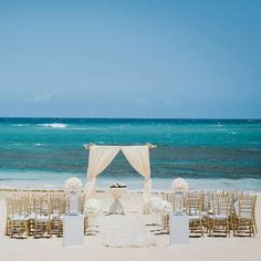 an outdoor wedding setup on the beach