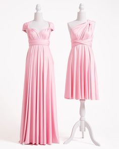 two dresses on mannequins, one in pink and the other in white