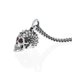 .925 Sterling Silver Garnet Eyes Pendant Dimensions - 15mm x 15mm x 20mm 24" fine curb chain with King Baby tag and lobster clasp Sterling Silver Skull Jewelry With Polished Finish, Sterling Silver Punk Pendant Jewelry, Punk Sterling Silver Pendant Jewelry, Punk Style Sterling Silver Pendant Jewelry, Sterling Silver Punk Style Chain Jewelry, Punk Skull, King Baby, Designer Handmade Jewellery, Jewelry For Men