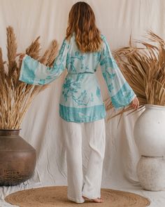 Feel the softness of summer with our Bohemian Breeze Modal Kimono! This sustainable style stunner boasts organic fabrics and a luxurious look that's perfect for sunny days. With an endless sunset color, you'll be radiating every day! Spring V-neck Tunic For Loungewear, Spring Bohemian Blouse For Loungewear, Flowy Long Sleeve Kimono For Loungewear, Flowy V-neck Kimono For Day Out, Flowy Long Sleeve Spring Kimono, Fall Vacation Tunic With Relaxed Fit, Spring Casual Tunic For Day Out, Spring Loungewear Tops With Kimono Sleeves, Spring Tunic Kimono For Loungewear