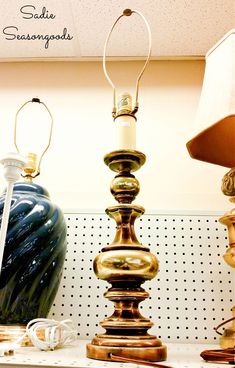 two lamps sitting next to each other on a shelf