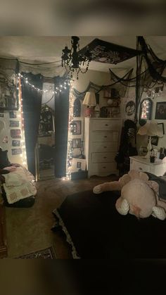 a bedroom decorated with halloween decorations and lights