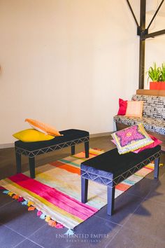 a living room filled with lots of colorful furniture