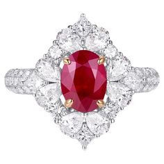 This extraordinary ring showcases a GIA-certified 1.30-carat Burma ruby, renowned for its vivid red hue and exceptional quality. The oval-cut ruby, ethically sourced from the legendary mines of Burma (Myanmar), serves as the centerpiece of this luxurious creation. Its rich and intense color is a hallmark of the finest rubies, offering a timeless elegance that captivates the eye. Encircling the ruby is a halo of 0.66 carats of brilliant-cut diamonds, meticulously arranged to enhance the gemstone' Ruby Ring Set, Ruby Diamond Ring, Burma Myanmar, Ruby Diamond Rings, Platinum Engagement Rings, Deco Engagement Ring, Ruby Stone, Modern Ring, Art Deco Engagement Ring