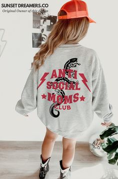 Step into the world of motherhood with a twist with our 'Antisocial Moms Club Cool Moms Sweatshirt.' This unique and comfy sweatshirt is the ideal gift for the modern mom who embraces both her cool and antisocial sides. Whether you're a first-time mom, expecting, or just looking for a special present for a mom in your life, this sweatshirt fits all occasions. It's a fun, stylish way to celebrate the journey of motherhood, making every mom feel like she's part of an exclusive yet relatable club. Antisocial Moms Club, Antisocial Aesthetic, Cool Mom Aesthetic, Cool Mom Shirts, Cool Moms Club, Patch Clothing, Sweatshirt Fits, First Time Mom, Strong Mom