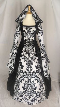 This listing is for a custom made dress, it will be made to the measurements you send me. Please send me your bust, waist and hip measurement, and please measure from the top of your shoulder to the floor with shoes on. It will be made with beautiful jet black crushed velvet and stunning white & black flocked taffeta. It has a corset style front and back with black lacing so you can adjust the dress to fit your body shape. Combined shipping on multiple items. If you purchase express shipping by courier please send me your phone number thank you. Black Wedding Gown With Boned Bodice, Gothic Ball Gown For Wedding, Black Ball Gown With Boned Bodice, Gothic Wedding Dress With Fitted Bodice, Black Gown With Fitted Bodice For Costume Party, Fitted Gothic Ball Gown, Vintage Black Gown For Wedding, Vintage Black Wedding Gown, Gothic Fitted Gown For Fancy Dress