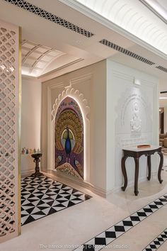 the interior of a hotel lobby with an intricately designed wall and flooring,