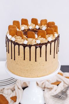 a cake with marshmallows and chocolate drizzled on the top