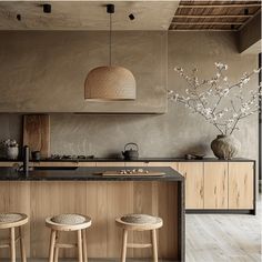 two stools sit in front of an island counter