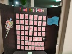 a pink and black board with pictures on it that says find the joker in different languages