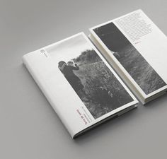 an open book with black and white photos on it