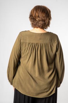 Stevie Nicks called and she wants her summer of love inspired hippie top back. This perfect lightweight long-sleeve embroidered peasant top can amplify any outfit from 1970s hippie to modern metropolitan boho chic. With tasseled drawstrings and delicate embroidery accenting a v-neck cut, this simple top is surely a staple for any closet. Did we mention the cinched sleeves? Pair it with pants, a loose flowy skirt, leggings, or shorts, your top half is covered and the rest of the outfit is up to y Bohemian V-neck Rayon Peasant Top, Bohemian Style Relaxed Fit Blouse For Spring, Bohemian Relaxed Fit Tops For Spring, Spring Bohemian Relaxed Fit Tops, Chic Long Sleeve Embroidered Cotton Top, Flowy V-neck Rayon Peasant Top, Bohemian Relaxed Fit Tops For Fall, Relaxed Fit Bohemian Top For Fall, Bohemian Relaxed Fit V-neck Blouse