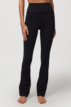 Supermodel status. A high-rise, body-hugging bootcut pant with a built-in hidden cell phone back pocket. Designed with our Dream Tech Eco Jersey that is compressive, moisture-wicking, quick-drying, and anti-odor. | Giselle Bootcut Pant in Black Straight Leg Athleisure Bottoms For Fall, Fall Athleisure Straight Leg Bottoms, High Rise Athleisure Bottoms For Fall, Fall High Rise Athleisure Pants, Black Mid-rise Yoga Pants For Fall, High Rise Sporty Bottoms For Fall, High Rise Activewear For Fall, Black Casual Yoga Pants With Minimal Stretch, Sporty High Rise Bottoms For Fall