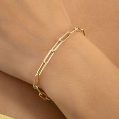 14k Solid Gold Paperclip Chain Bracelet, Elegant Minimalist Jewelry, Modern Fashion Statement, Chic Everyday Accessory, Unique Gift for Her Add sophistication to your everyday style. This elegant yet simple paperclip bracelet makes a contemporary addition to your personality.  With the paperclip design linkage style of this gorgeous bracelet, you cannot refuse the attraction of this bracelet. The lightweight and easy-to-carry bracelet will be your best companion in your style need wherever you want to wear this! ◆ You'll have: - 14k solid gold handcrafted bracelet or gold plated 925k silver - 100% US-sourced jewelry ◆ Material: 14k Solid Gold or Gold Plated 925k Silver based on your selection ◆ Chain thickness: 4 mm ◆ Chain length: Based on your selection ◆ Chain Style: Paperclip Chain ★ ★ Gold-tone Link Paperclip Bracelet In Minimalist Style, Gold-tone Link Paperclip Bracelet Minimalist Style, Minimalist Rose Gold Link Paperclip Bracelet, Minimalist Gold-tone Paperclip Bracelet With Solid Links, Minimalist Gold-plated Paperclip Chain Bracelet, Minimalist Tarnish-resistant Paperclip Bracelet For Formal Occasions, Minimalist Tarnish-resistant Paperclip Bracelet, Minimalist Gold-tone Paperclip Bracelet With Adjustable Chain, Minimalist Gold Plated Paperclip Bracelet With Solid Links