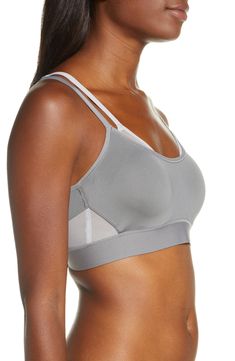 With the support of two sports bras in one, this lightweight style that wicks away moisture is perfect for cardio or running. Memory-foam straps and a wide elastic bottom band help the design stay put while mesh cutouts give you breathable comfort. Light foam cups give shape and projection Underwire 85% CoolMax® polyester, 15% Lycra® spandex Hand wash, line dry Imported Lingerie Sporty Bra For Workout, Sporty Workout Bra With Straps, Sporty Workout Bra, Supportive Athleisure Sports Bra With Straps, Athleisure Training Bra With Adjustable Straps, Sports Bra With Stretch Straps, Functional Sports Bra With Straps For Training, Sports Racerback Bra With Straps, Sporty Racerback Sports Bra With Straps