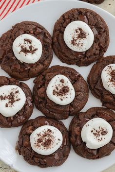 chocolate cookies with marshmallows on a white plate