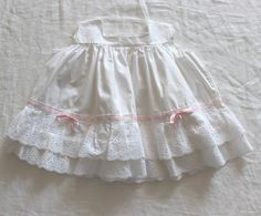 "FRENCH VINTAGE 50's, stunning white summer dress, pure cotton fabric, French lace ruffles and pink satin ribbon, buttoned at the back ( mother of pearl buttons ).  Estimated size 1 year Length \" - Underarams ( taken flat ) \" New old stock ( washed once ) I always refund overcharged shipping from 1 Euros overpaid ! Thank you for your visit" White Cotton Dress With Attached Cancan, White Cotton Dress With Broderie Anglaise, White Cotton Lace Dress For Spring, White Cotton Dress With Lace Trim, Summer Wedding Dress With Eyelet Details, Spring Broderie Anglaise Cotton Lace Dress, White Cotton Lace Patchwork Dress, Fitted Cotton Lace Broderie Anglaise Dress, Cotton Broderie Anglaise Wedding Dress