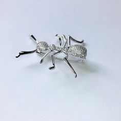 Shiny silver-tone CZ crystal ant brooch Not intended for children ages 13 and under. Also, for many items we can accommodate large orders, so please send us a message. Silver Novelty Pins For Gifts, Silver Novelty Brooches For Gifts, Star Darlings, Pretty Pins, Animal Brooch, Pin Jewelry, Cat Pin, Shiny Silver, Ants