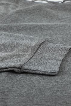 Gray French Terry Cotton Blend Pullover Sweatshirt Cotton Stretch Sweater With Ribbed Collar, Cotton Sweater With Stretch And Ribbed Collar, Stretch Cotton Sweater With Ribbed Collar, Cotton Sweater With Ribbed Collar And Stretch, Stretch Cotton Sweatshirt With Ribbed Collar, Stretch Cotton Sweatshirt With Ribbed Cuffs, Cotton Tops With Ribbed Neckline For Winter, Gray Winter Loungewear T-shirt, Heather Grey Long Sleeve Sweatshirt