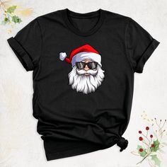 "Christmas Cool Santa Shirt, Merry Christmas Santa Shirt, Beard Santa Glasses Shirt, Christmas Gift for Dad, Xmas Santa Shirt, Christmas Party Hello, Thanks for your support. Your gladness comes first and all work is done with LOVE in here. Always keep your support, please:) Christmas Cool Santa Shirts are branded Bella+Canvas. Christmas Cool Santa Shirt Contents: - Solid colors: %100 Cotton. - Heather colors: %52 Cotton + %48 Polyester* This ultra-soft graphic tee is made from a comfortable cot Santa Tshirt, Santa Shirt, Santa Shirts, Merry Christmas Santa, Christmas Gift For Dad, First They Came, Gift For Dad, Christmas Santa, Christmas Design