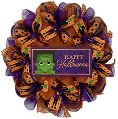 a purple and orange wreath with a happy halloween sign on it