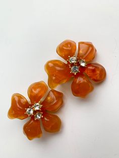 Large Floral Gripoix style earrings by Couture collection of an Iconic American Jewelry Designer Kenneth Jay Lane - signed also retain its original holder. They are in great vintage condition - flowers measure 1.5 inches high - beautiful bright orange color. Please look at all the pictures, video and dimensions carefully as I don't accept returns. Generally I ship the next day - please reach out if you have any questions - Thank you for coming to my store Vintage Flower Earrings, Orange Blossom Costume, Orange Jewelry, Collection Couture, Orange Earrings, Orange Flower, Flower Tops, Black Necklace, Stunning Earrings