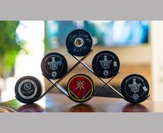 a group of golf balls sitting on top of a wooden table next to each other