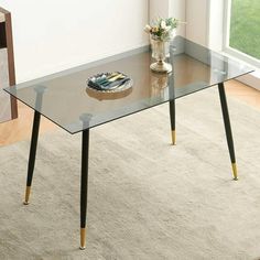 Elevate the look of your dining room with this ultra-modern table. Its compact, rectangular design makes it a great choice for a space-conscious home. It has straight, round legs made of iron that supports a transparent top made from tempered glass. We love the airy, light look that this table brings to your space. And, imagine it with a pretty faux fur dining chairs. Best of all, its so easy to clean or dust. Color: Clear. Kitchen Table For 4, Fur Dining Chair, Rectangular Kitchen Table, Modern Glass Dining Table, Coffee Table Small Space, Rectangular Kitchen, Transparent Top, Glass Dining Table, Ultra Modern