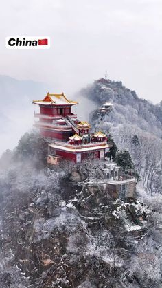 a building on top of a mountain covered in snow with the words china above it