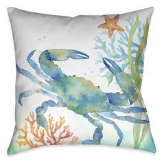 a blue crab and starfish on a white pillow