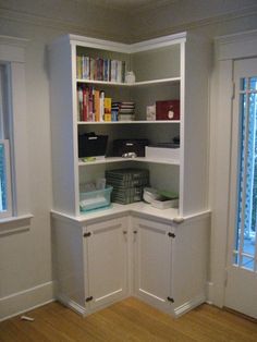 an empty room with some bookshelves and other items on the shelves in it