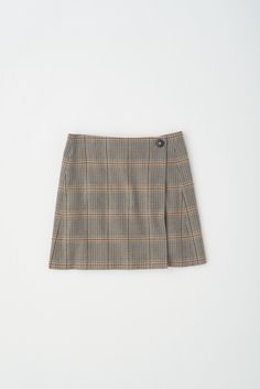 Our luxe take on the classic mini skirt. Crafted from premium wool and fully lined with 100% Cupro lining. The Rosetta Wool Skirt features a wrap-over closure, adorned with a decorative button on the exterior and a discreet hidden button on the interior, ensuring a snug and secure fit. Classic Mini Skirt, Wool Skirt, Wool Skirts, Classic Mini, Mini Skirt, Mini Skirts, Exterior, Wool, Skirt