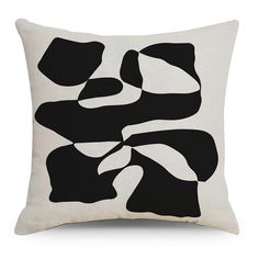 a black and white pillow with an abstract design