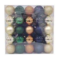 assorted christmas ornaments in clear plastic package with white and gold balls on each ornament