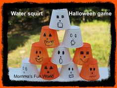 a group of paper cups with faces painted on them and the words water squirt halloween game