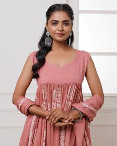 This coral mul-mul anarkali set is perfect for adding a pop of color to any occasion. Hand block printed for an exquisite finish, it features delicate lace work and a matching dupatta adorned with tassels. Crafted for both elegance and comfort, this set is the perfect addition to your wardrobe. No. of pieces - 3 piece set. Color - Coral. Fabric - Mul-Mul. Washing Instructions - Dry Clean. Designer Pink Palazzo Set With Bandhani Print, Eid Bandhani Print Georgette Palazzo Set, Designer Wear Pink Palazzo Set With Bandhani Print, Semi-stitched Block Print Palazzo Set For Wedding, Pink Anarkali Set With Printed Motifs For Festive Occasion, Festive Pink Anarkali Set With Printed Motifs, Designer Bandhani Print Anarkali Set In Georgette, Designer Georgette Anarkali Set With Bandhani Print, Pink Anarkali Palazzo Set With Printed Motifs