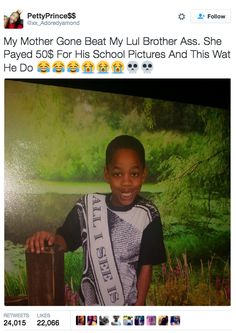 a young boy is smiling and posing for the camera with his sash around his neck