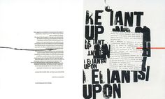 an open book with black and white typograms on the pages, next to a red marker