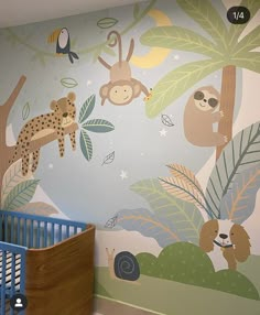 a baby's room decorated in blue and green with monkeys, giraffes, and other animals