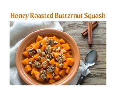 a bowl filled with butternuts and nuts on top of a wooden table