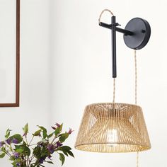 a lamp that is next to a potted plant